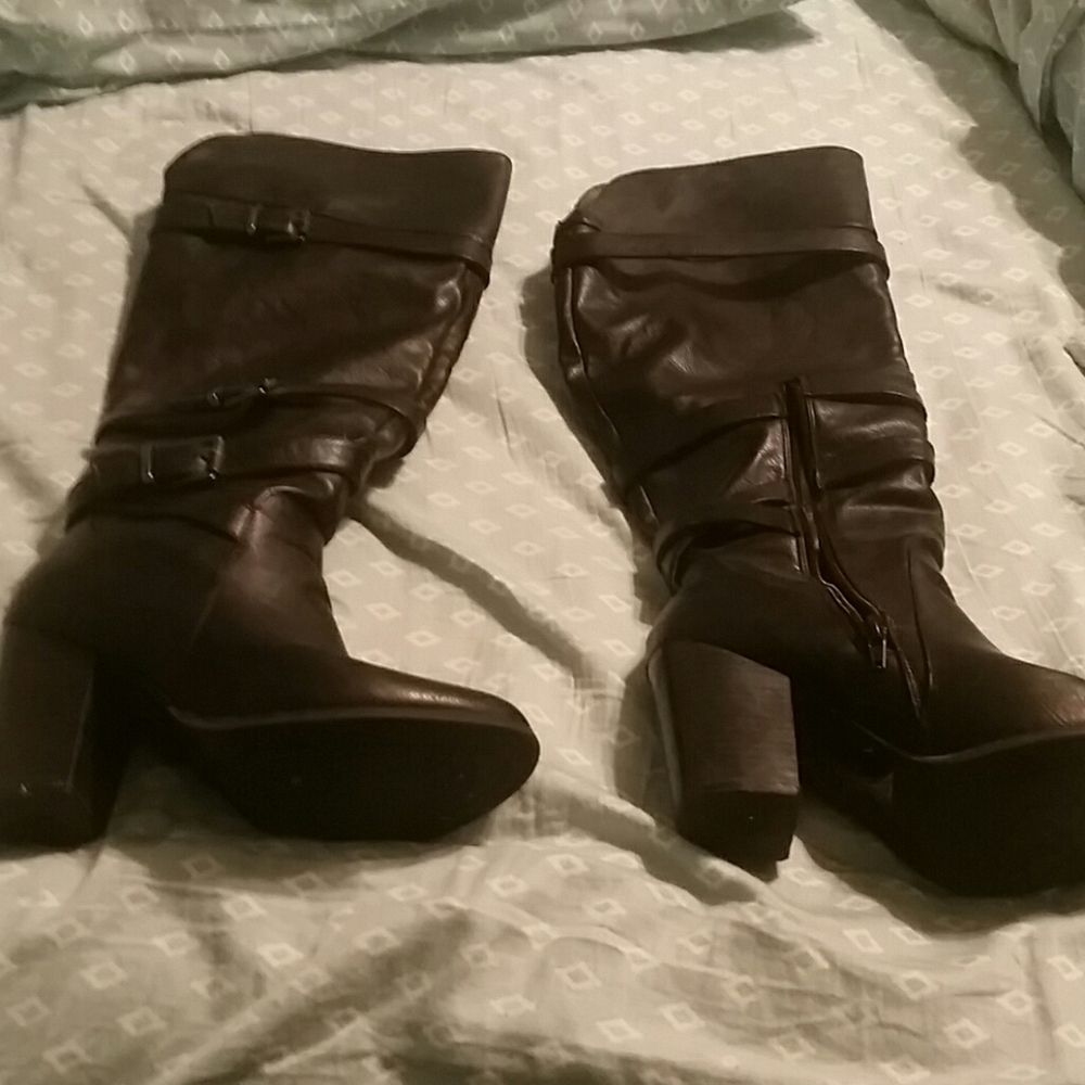 Black to the knee buckle heeled boot